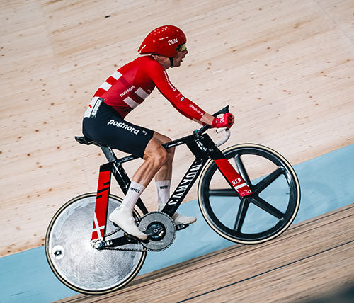 Indoor track cyclist wearing aerodymic DeFeet Evo Jet Aero cycling socks